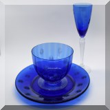 G76. 17-Piece cobalt blue etched glass luncheon and dessert set. Includes 8 plates, 8 bowls and 1 goblet. Some small chips. - $34 